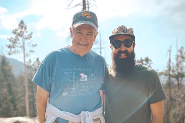 Grant Townsend hiking with his grandson, JT.