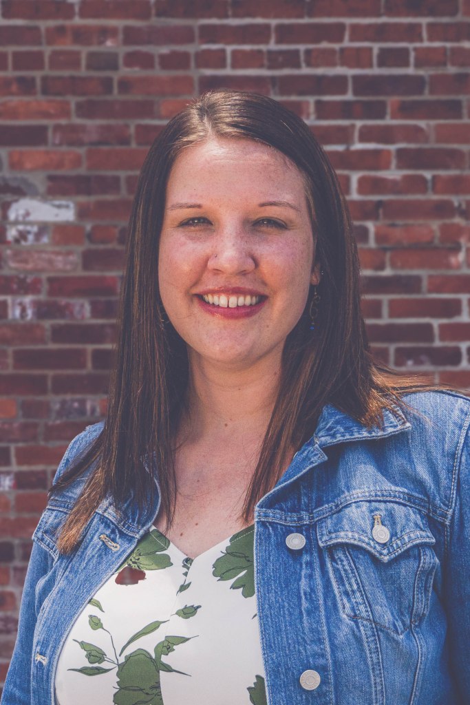 Savannah Stepp stands in front of a brick wall. She has been in full-time ministry to women experiencing trafficking and exploitation in Springfield, Missouri, for the past 10 years.